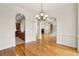 Open concept view from dining room through kitchen to living room with fireplace and soaring ceilings at 2503 Regency Lake Dr, Marietta, GA 30062