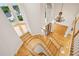 Grand entryway with a curved staircase, hardwood floors, and a stunning chandelier at 2503 Regency Lake Dr, Marietta, GA 30062