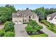 Beautiful two-story home boasts arched windows, a three-car garage, and a well-maintained front yard at 2503 Regency Lake Dr, Marietta, GA 30062