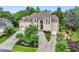 Elegant two-story residence with a three-car garage, lush landscaping, and a welcoming front entrance at 2503 Regency Lake Dr, Marietta, GA 30062