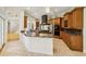 Spacious kitchen features granite counters, a large island, stainless appliances, and beautiful custom cabinetry at 2503 Regency Lake Dr, Marietta, GA 30062