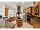 Spacious kitchen featuring a large island cooktop, stainless steel appliances, and custom cabinetry at 2503 Regency Lake Dr, Marietta, GA 30062