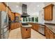 This spacious kitchen features granite counters, stainless steel appliances, and an island cooktop at 2503 Regency Lake Dr, Marietta, GA 30062