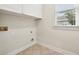 Laundry room includes storage cabinets and a window at 2503 Regency Lake Dr, Marietta, GA 30062