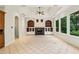 This living room offers a fireplace, built-in shelving, and floor-to-ceiling windows overlooking the backyard at 2503 Regency Lake Dr, Marietta, GA 30062