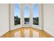 Sun-drenched living room features hardwood floors and large windows with neighborhood views at 2503 Regency Lake Dr, Marietta, GA 30062