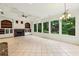 Living room features fireplace, built-ins, backyard views, and recessed lighting at 2503 Regency Lake Dr, Marietta, GA 30062