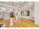 Open-concept living space with kitchen view, a grand staircase, soaring ceilings, and gleaming hardwood floors at 2503 Regency Lake Dr, Marietta, GA 30062