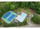Aerial view of community tennis courts, pool, playground, and well-maintained green spaces at 3915 Woolbridge Way, Marietta, GA 30062