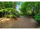 Serene backyard with mature trees and a wooded view, offering privacy at 3915 Woolbridge Way, Marietta, GA 30062