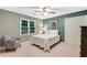 Cozy bedroom featuring a queen bed, chair and neutral walls with a window at 3915 Woolbridge Way, Marietta, GA 30062
