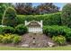 View of the Dorset community entrance sign surrounded by manicured landscaping and flowers at 3915 Woolbridge Way, Marietta, GA 30062