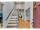 Bright foyer boasts hardwood floors, a staircase, and access to multiple rooms at 3915 Woolbridge Way, Marietta, GA 30062