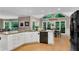 Modern kitchen with white cabinets, granite countertops, and an adjacent dining area with views at 3915 Woolbridge Way, Marietta, GA 30062
