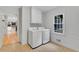 Bright laundry room features a window, light beige tile floor, and washer and dryer at 3915 Woolbridge Way, Marietta, GA 30062