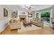 Cozy living room featuring a fireplace, built-in shelves, and a large bay window at 3915 Woolbridge Way, Marietta, GA 30062