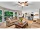 Spacious living room with large windows, open to the kitchen and dining area at 3915 Woolbridge Way, Marietta, GA 30062