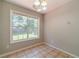 Cozy breakfast nook with tile floors and a large window offering views of the outdoor scenery at 647 New England Way, Lawrenceville, GA 30046