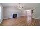 Bright living room with hardwood floors, fireplace, vaulted ceiling, and ample natural light at 647 New England Way, Lawrenceville, GA 30046