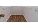 A walk-in closet featuring hardwood flooring and metal shelving at 647 New England Way, Lawrenceville, GA 30046