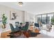 Open-concept dining area with modern lighting, stylish furniture, and hardwood floors at 1280 W Peachtree Nw St # 3208, Atlanta, GA 30309