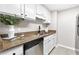 Functional kitchen with ample counter space, modern appliances, and white cabinetry at 1280 W Peachtree Nw St # 3208, Atlanta, GA 30309