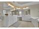 Spacious bathroom showcasing a double vanity with white cabinets, tile flooring, and framed mirrors at 793 Fairington Pl, Lawrenceville, GA 30044
