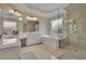 A luxurious bathroom features a separate shower and soaking tub with tile floors and dual sinks at 793 Fairington Pl, Lawrenceville, GA 30044