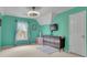 Bright bedroom featuring an accent wall, natural light, and neutral-colored carpet flooring at 793 Fairington Pl, Lawrenceville, GA 30044