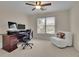 Home office/bedroom features a ceiling fan, neutral walls, and a comfortable lounge space at 793 Fairington Pl, Lawrenceville, GA 30044
