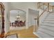 Elegant foyer with hardwood floors, staircase, and view of the dining room at 793 Fairington Pl, Lawrenceville, GA 30044