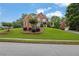 Traditional brick home with lush front yard and manicured landscaping on a sunny day at 793 Fairington Pl, Lawrenceville, GA 30044