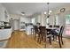 Eat-in kitchen featuring stainless steel appliances, an eat-at bar, and a large window with natural light at 793 Fairington Pl, Lawrenceville, GA 30044