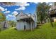 Light blue two-story home features a deck overlooking a sloping green lawn and surrounding trees at 1139 Mainstreet Valley Dr, Stone Mountain, GA 30088