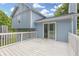 The backyard boasts a large white deck with access to the home through sliding glass doors at 1139 Mainstreet Valley Dr, Stone Mountain, GA 30088