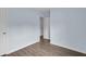 Bedroom with light blue walls and wood-look flooring and white trim at 1139 Mainstreet Valley Dr, Stone Mountain, GA 30088