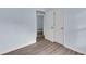 Bedroom with light blue walls and wood-look flooring with white doors and trim at 1139 Mainstreet Valley Dr, Stone Mountain, GA 30088