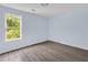 Bedroom with light blue walls and a window with a view of trees at 1139 Mainstreet Valley Dr, Stone Mountain, GA 30088