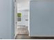 View into a small kitchenette with white cabinets, appliances and neutral countertops at 1139 Mainstreet Valley Dr, Stone Mountain, GA 30088