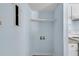 Bright laundry room with blue walls, utility hookups and an overhead shelf at 1139 Mainstreet Valley Dr, Stone Mountain, GA 30088