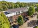 Stunning aerial view of the townhome showcasing its architectural details and surrounding greenery at 1300 Dekalb Ne Ave # 221, Atlanta, GA 30307