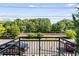 Balcony overlooking neighborhood with views of treeline and train tracks at 1300 Dekalb Ne Ave # 221, Atlanta, GA 30307