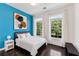 Bright bedroom featuring large windows and modern artwork at 1300 Dekalb Ne Ave # 221, Atlanta, GA 30307