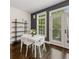 Bright dining area with modern table and chairs, shelving, and large windows overlooking outside at 1300 Dekalb Ne Ave # 221, Atlanta, GA 30307