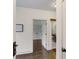 Bright hallway featuring hardwood floors and modern doors that lead to bedrooms and bathrooms at 1300 Dekalb Ne Ave # 221, Atlanta, GA 30307