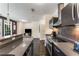 Well-lit kitchen with stainless steel appliances, tile backsplash, and ample counter space at 1300 Dekalb Ne Ave # 221, Atlanta, GA 30307