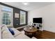 Cozy living room with a comfortable sofa, bright windows, and stylish decor at 1300 Dekalb Ne Ave # 221, Atlanta, GA 30307