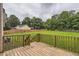 Spacious backyard with lush lawn and wooden deck at 275 Mountain Way, Covington, GA 30016