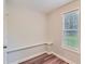Compact bedroom with modern wood floors and a sunlit window at 275 Mountain Way, Covington, GA 30016