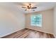 Cozy bedroom with wood-look floors and a window, offering a comfortable and inviting space at 275 Mountain Way, Covington, GA 30016